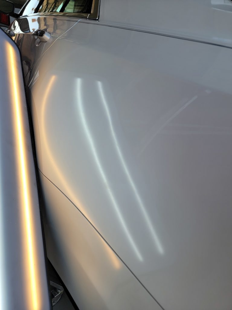 Sharp crease on quarter panel